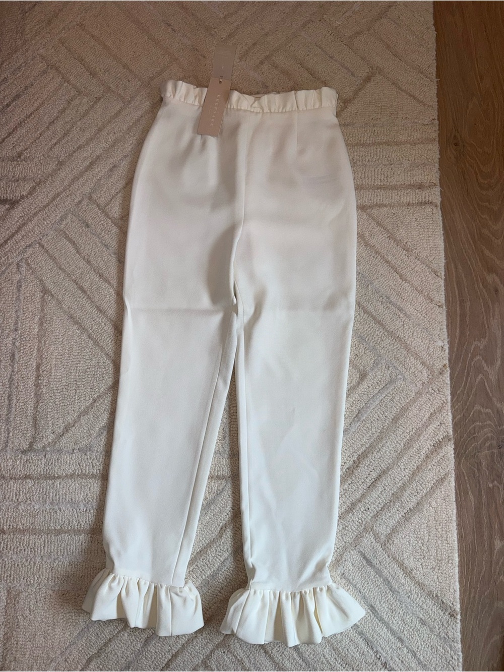 Cream Ruffle Hem Knit Pants